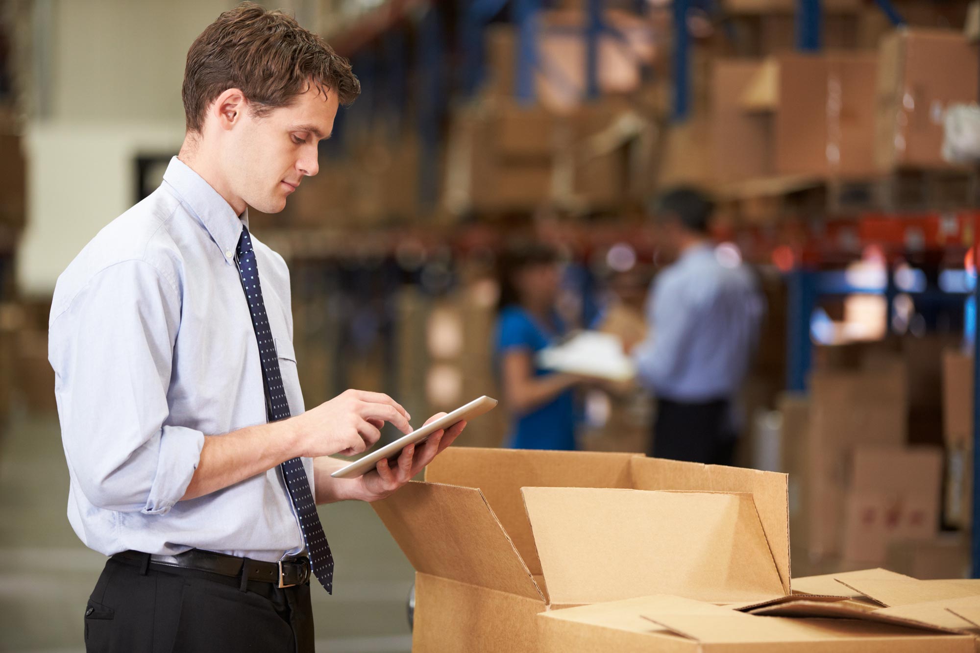 Manager-In-Warehouse-Checking-Boxes-Using-Digital-Tablet22.jpg